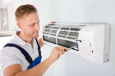 Important-Considerations-for-AC-Installation-and-Update – Copy HVAC technician cleaning and repairing a ductless mini split AC in Draper, UT